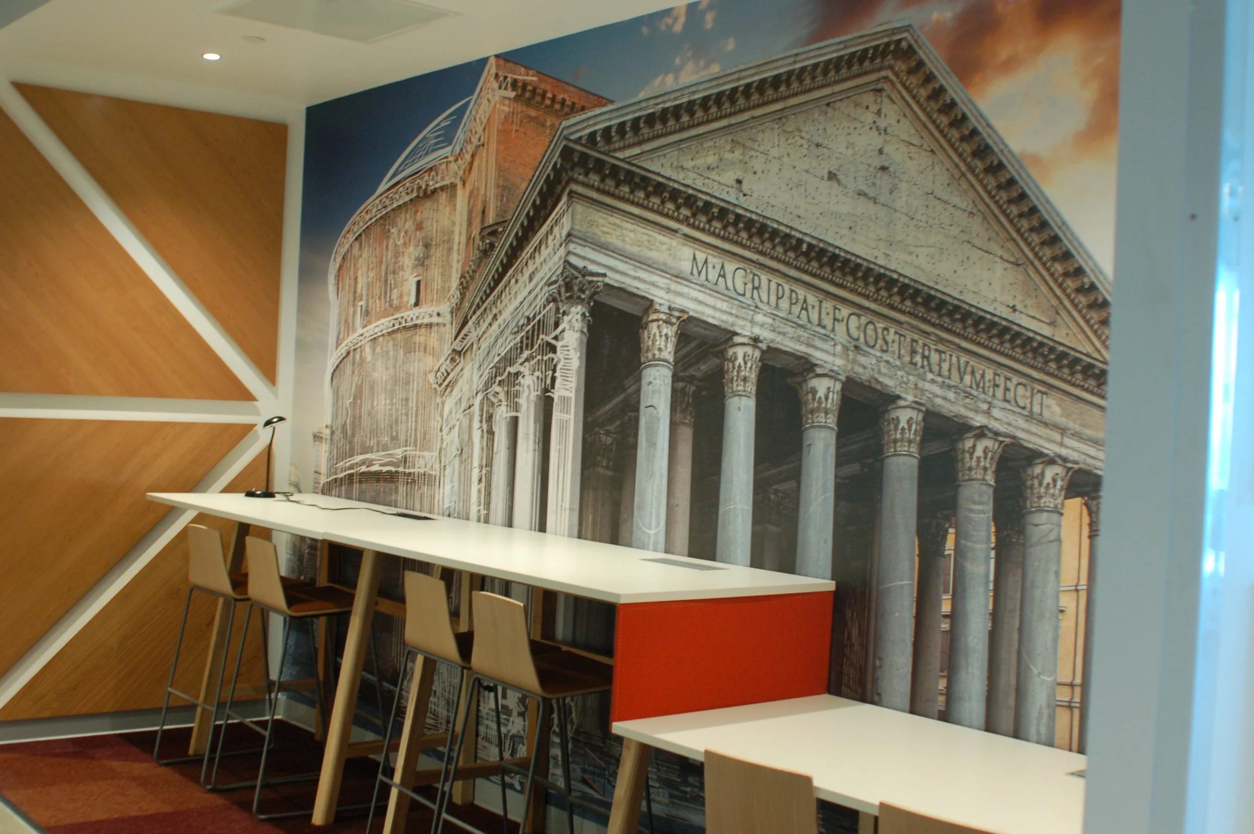 Large-format architectural mural wallcovering featuring a historic building, installed as a custom commercial feature wall.