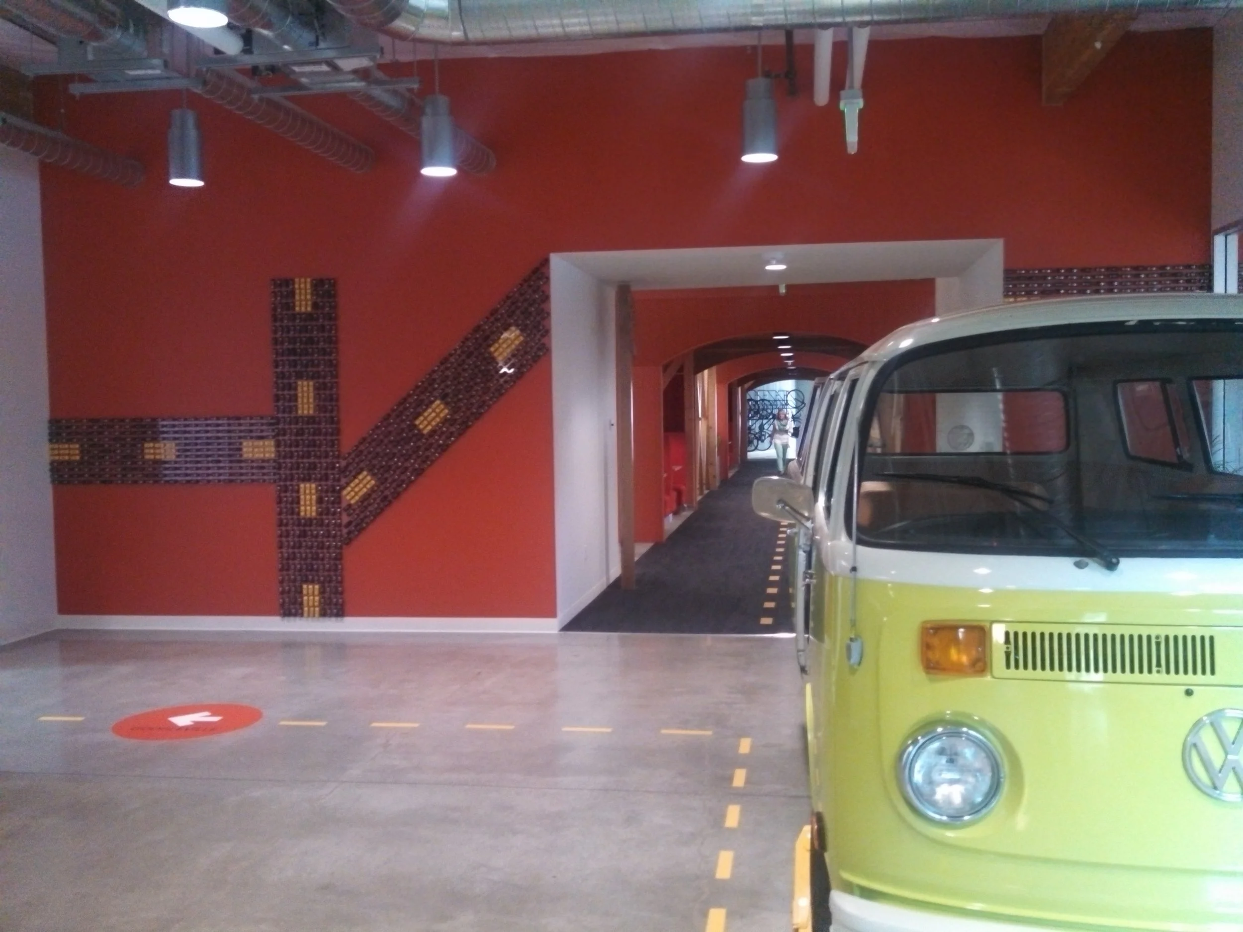 Custom commercial floor graphics and directional pathway installed in branded workspace to guide traffic flow and enhance navigation