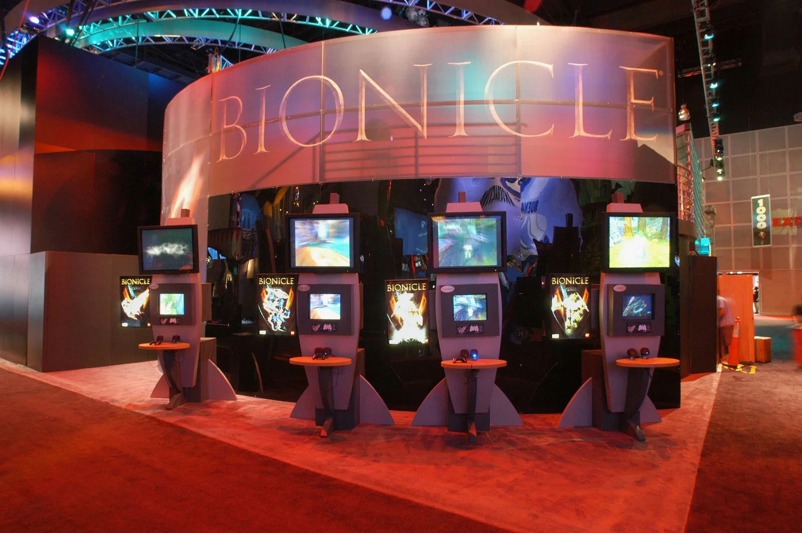 Custom trade show exhibit with illuminated graphics and interactive display elements for attendee engagement