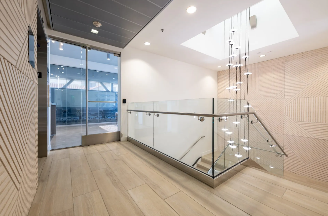 Interior space featuring Plyboo bamboo wall panel system providing natural texture and sustainable design for corporate environment.