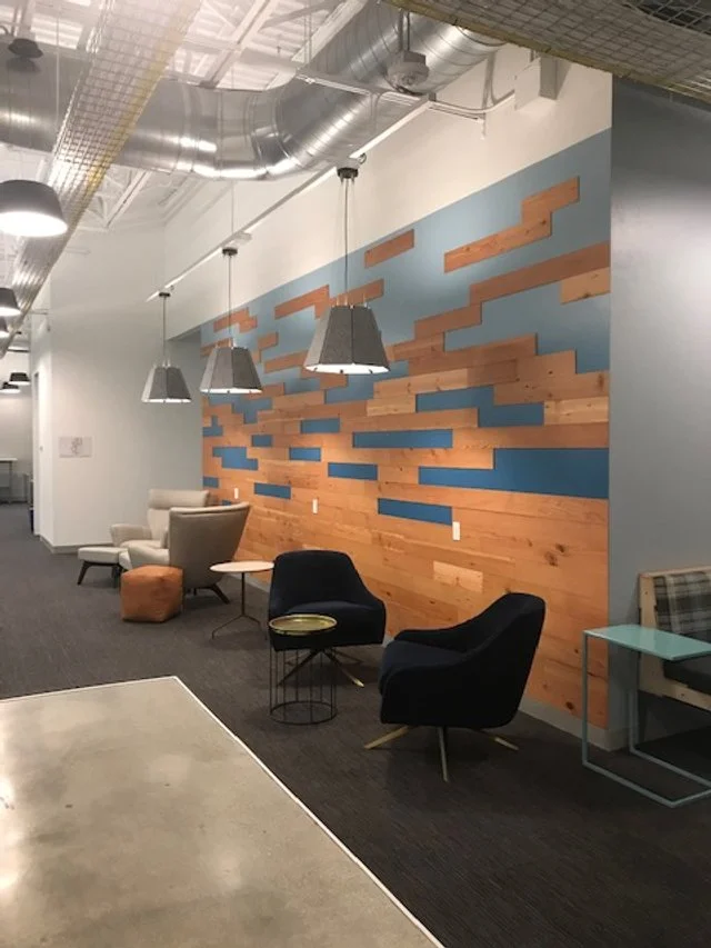 Mixed-finish architectural wood wall panels creating a modern feature in office environment