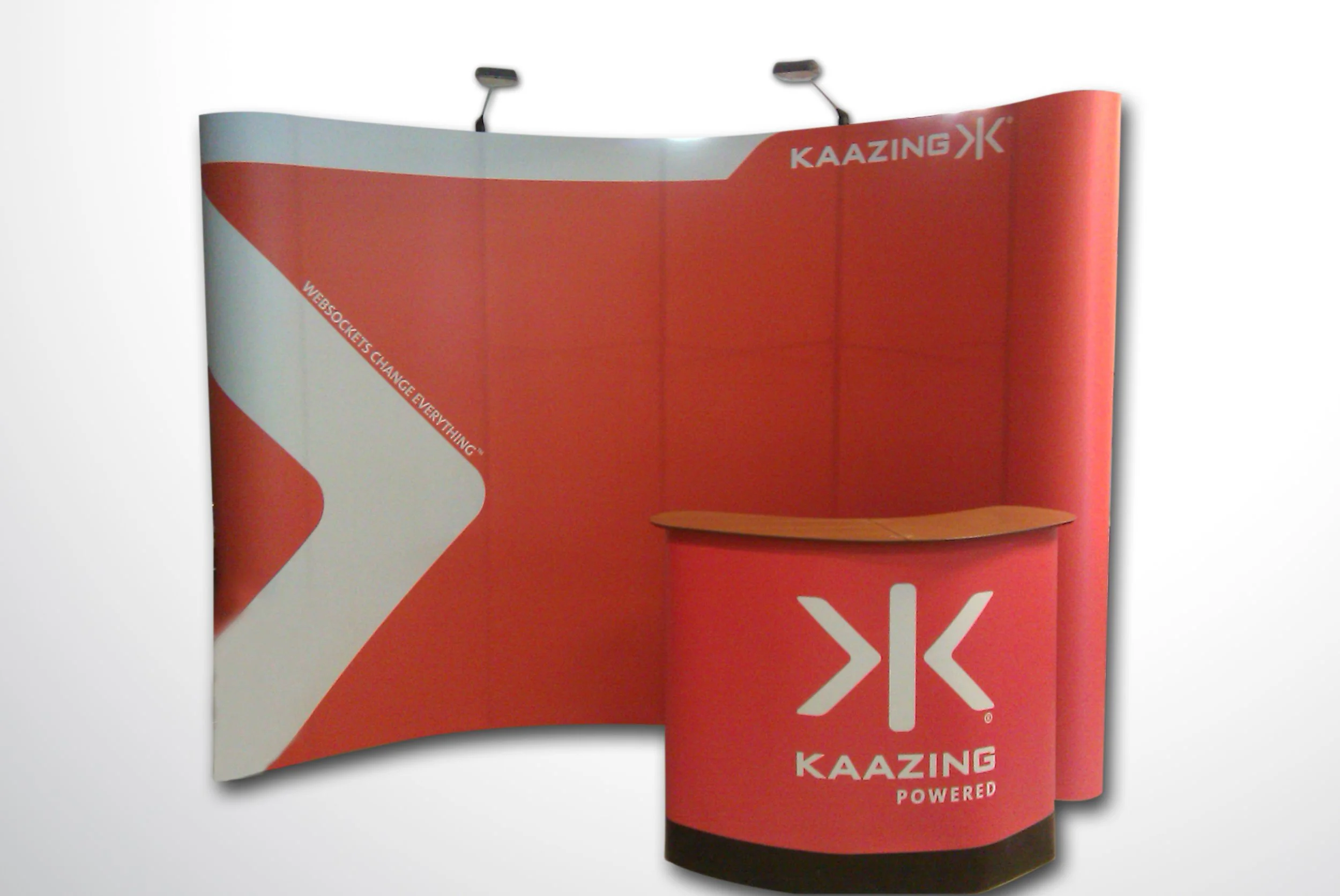 Custom exhibit wall graphics and branded trade show booth designed for corporate event presence