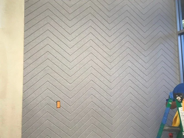 Textured patterned acoustic wall panels enhancing interior design and reducing echo