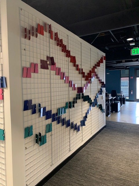 Interior view of completed dimensional fin wall installation at Google Santa Cruz, enhancing the workspace with color, texture, and depth.