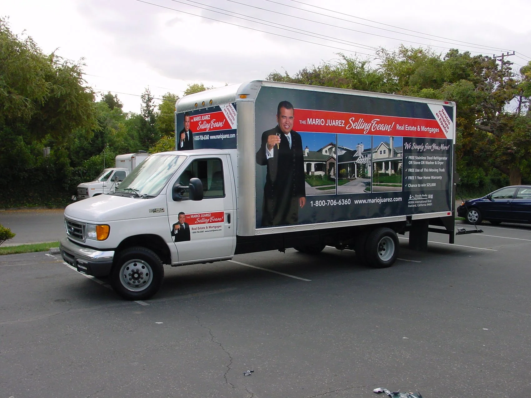 Side view custom box truck wrap with full-coverage graphics for mobile advertising and brand visibility.