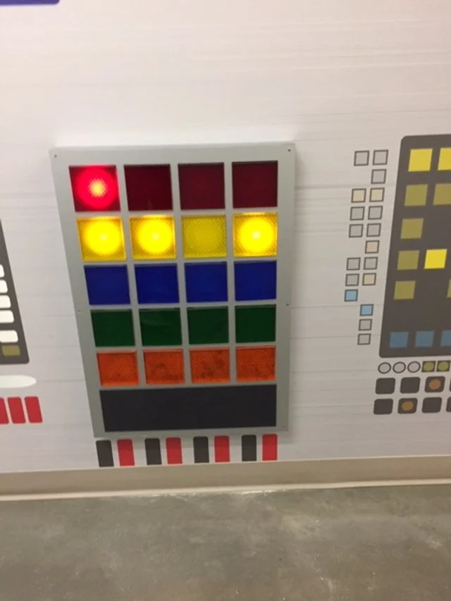 Custom modular wall system with integrated lighting designed to create an interactive and visually engaging feature.