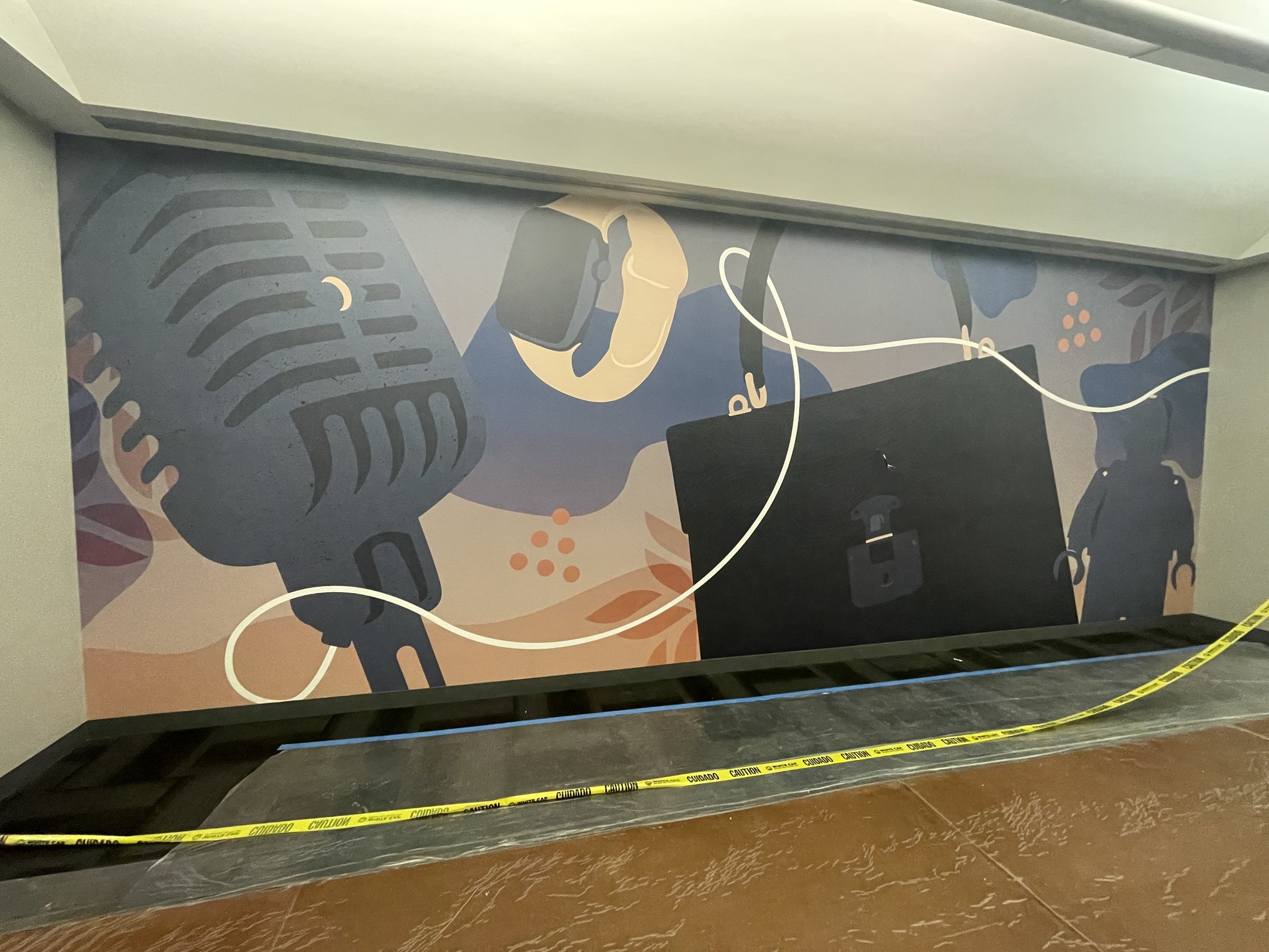 Full-width eBay Austin elevator lobby wallcovering installation featuring large-format instrument-themed environmental graphics.