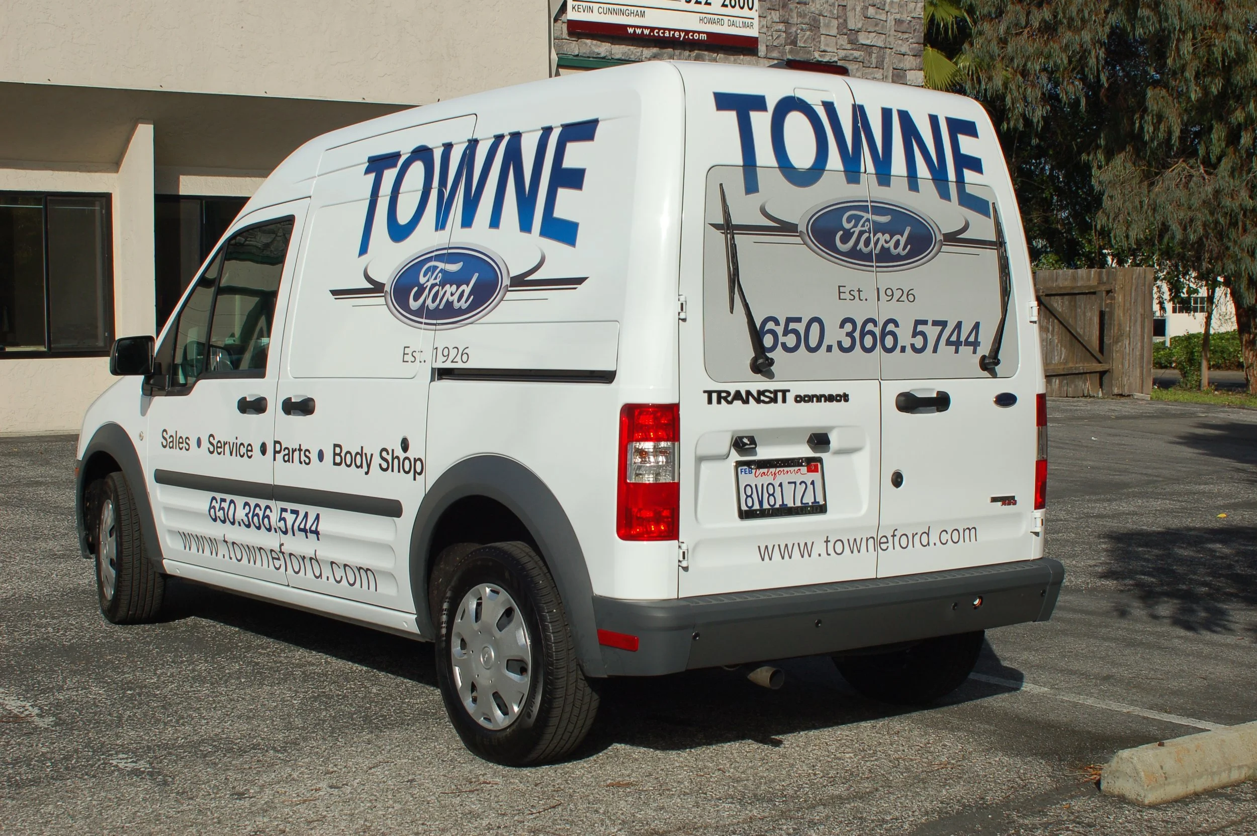 White cargo van with full fleet wrap and bold company graphics designed for high-impact mobile marketing.