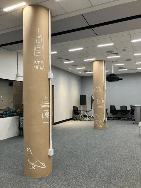 Custom column wrap with Pinterest-inspired icon wallcovering installed in San Francisco office, enhancing environmental branding and interior visual consistency by JP Digital.