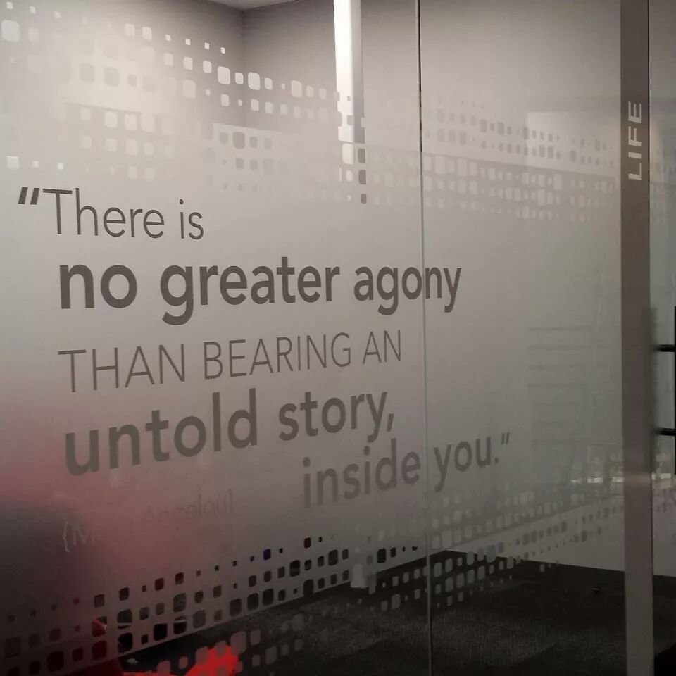 Gradient privacy window film with corporate messaging applied to office glass wall