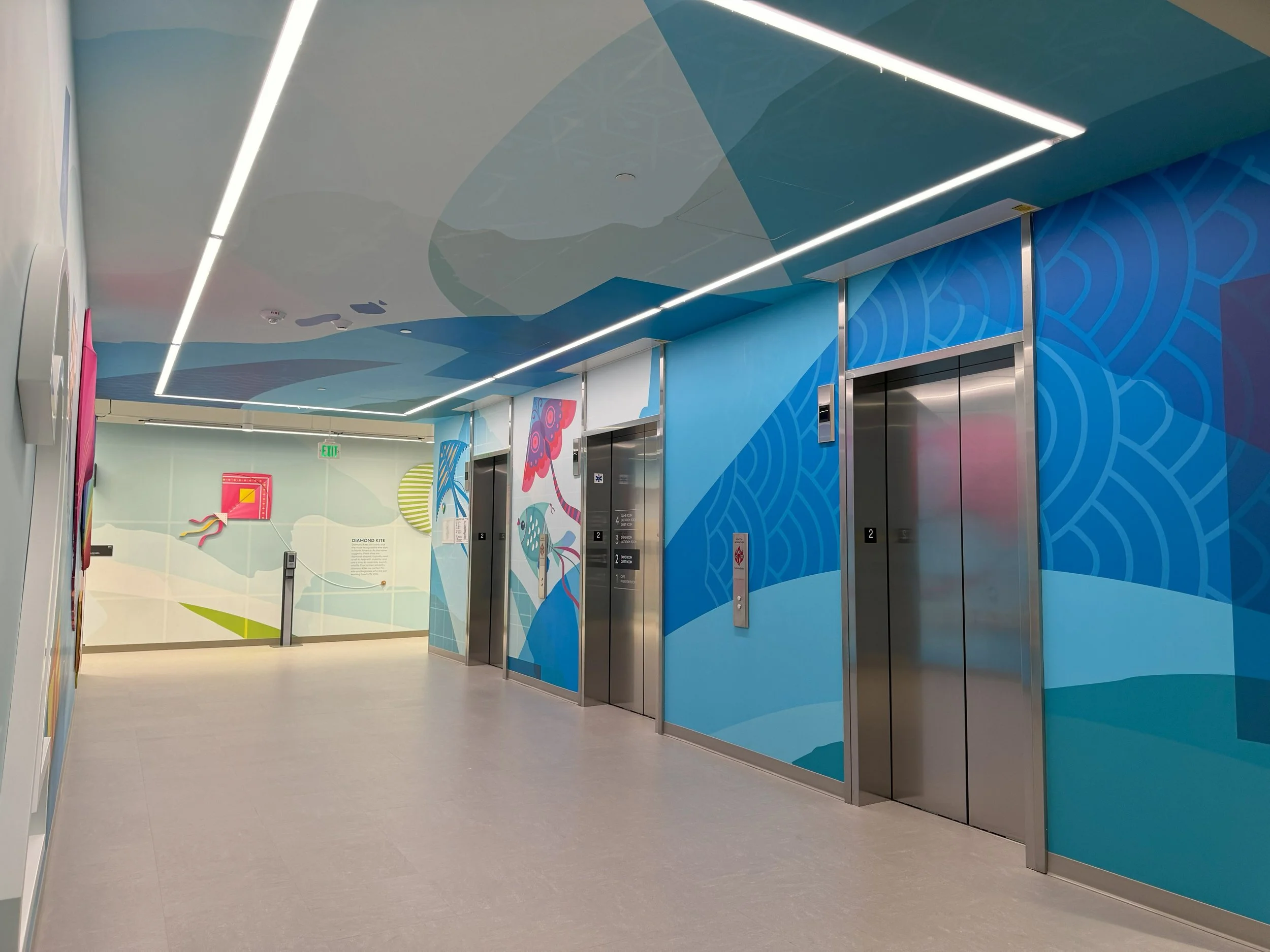 Custom environmental graphics and interior signage installed in corporate office space to enhance brand experience and workplace design.