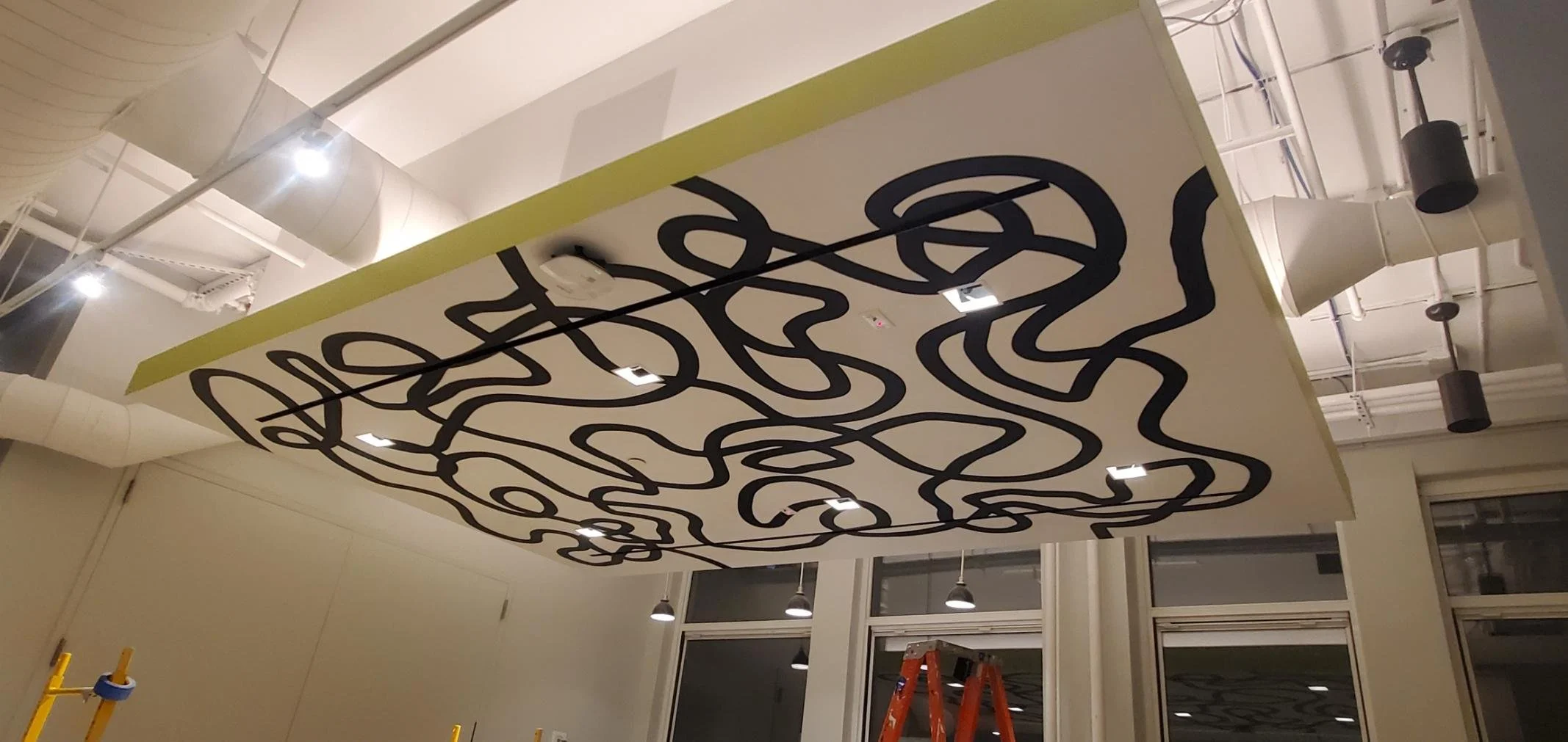 Installed abstract ceiling feature at eBay New York office featuring custom dimensional environmental graphics suspended above workplace area