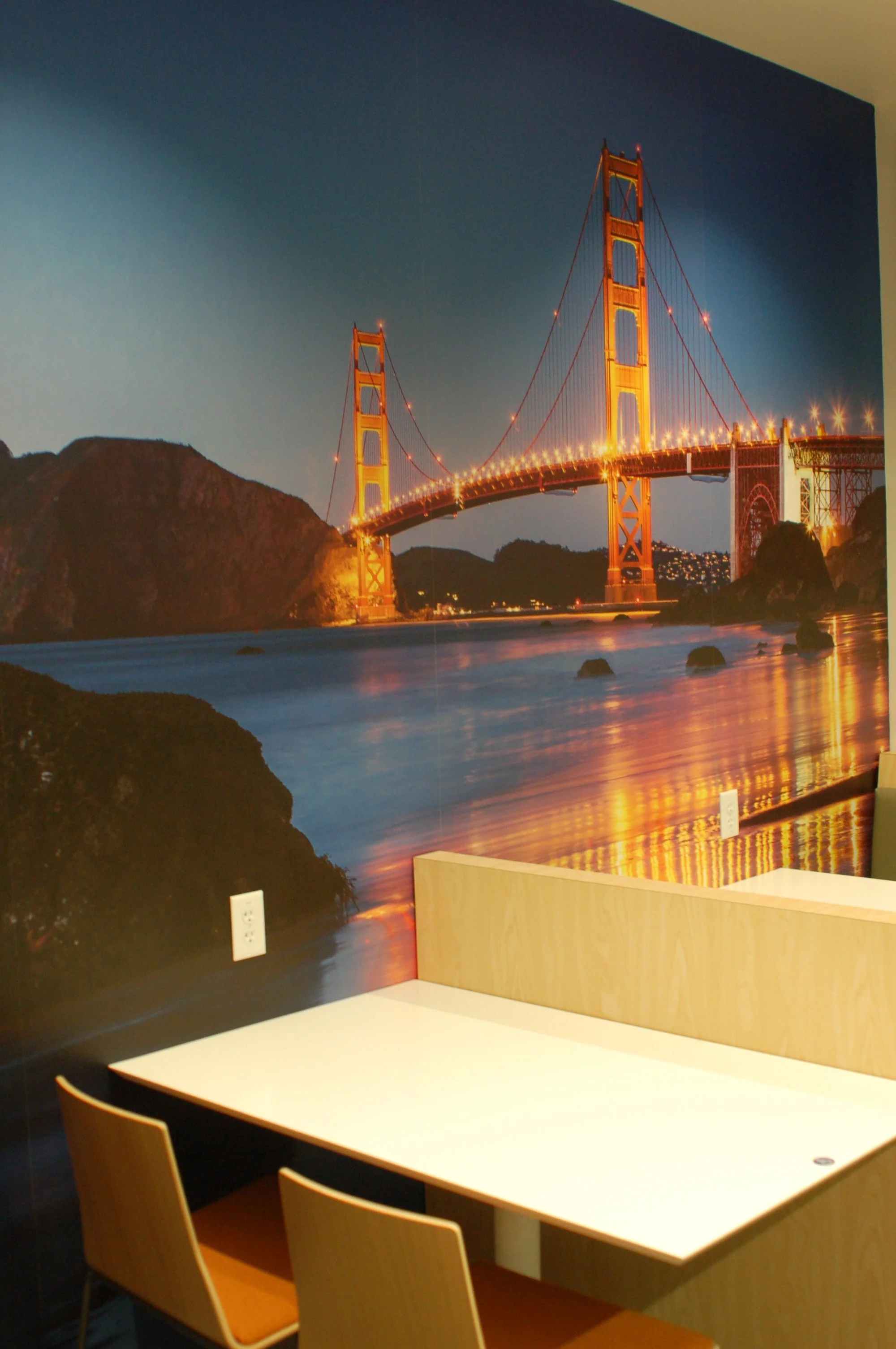Cityscape wall mural featuring the Golden Gate Bridge installed as a large-format environmental graphic.