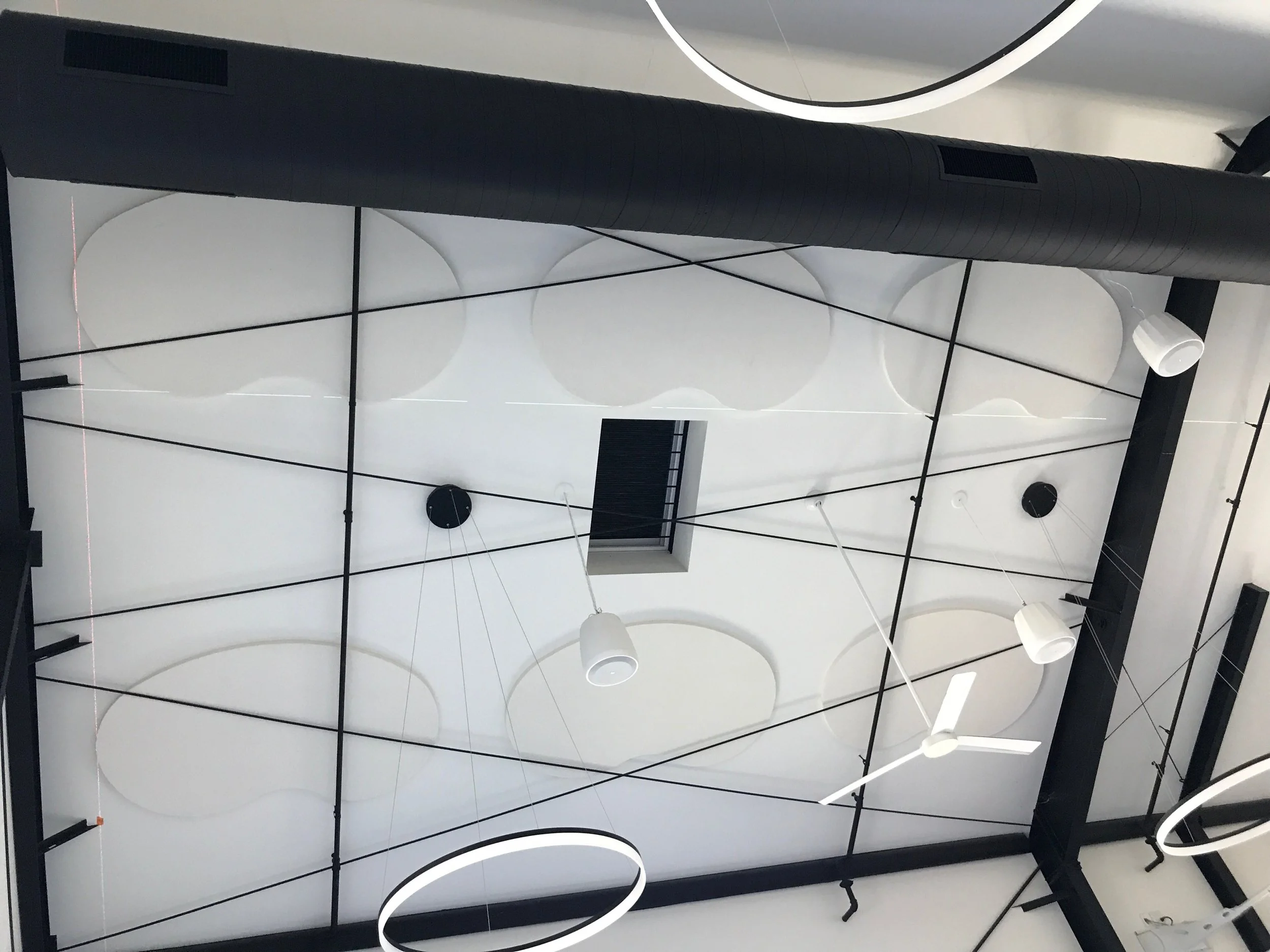 Geometric acoustic wall panel installation improving sound absorption and creating a modern architectural design feature