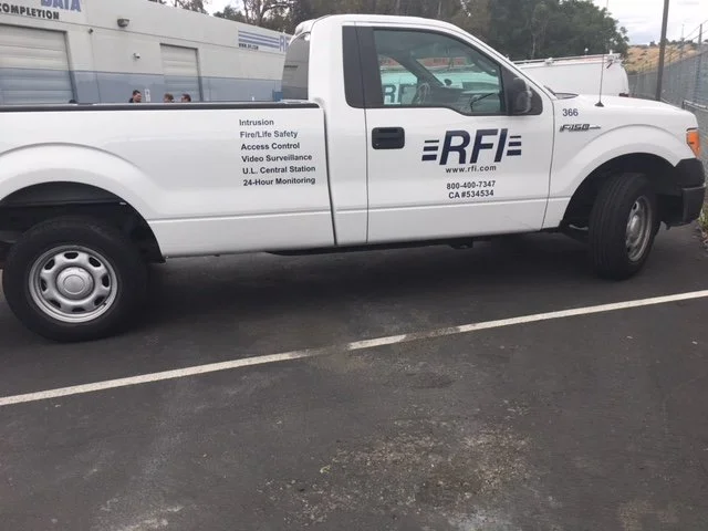 Fleet pickup truck graphics for RFI with logo, contact information, and service branding