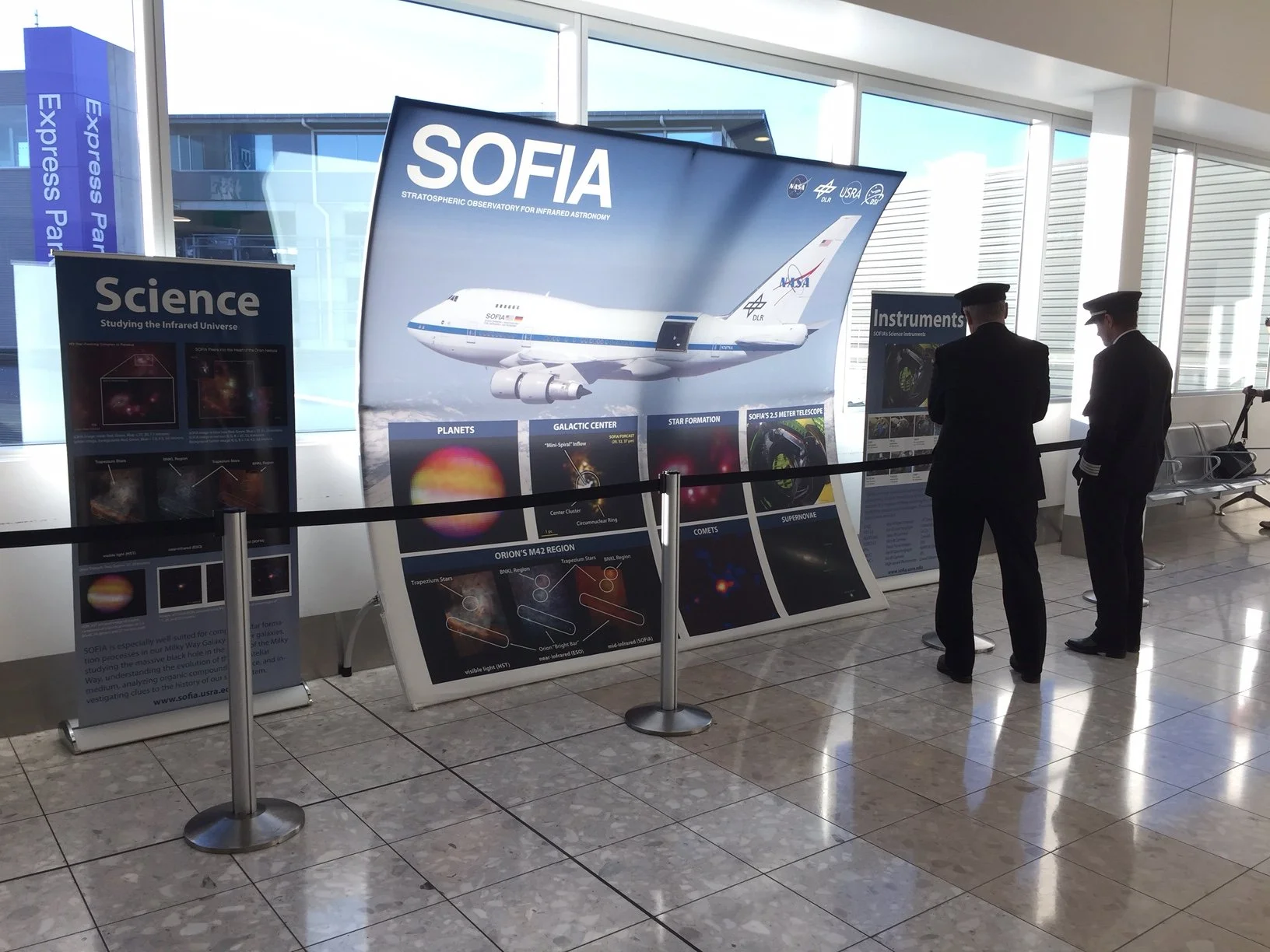 Custom freestanding trade show display with branded graphics for product marketing and demonstrations