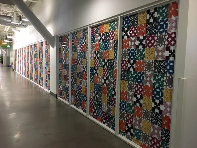 Custom colored acoustic panels used to enhance branding and improve workplace acoustics