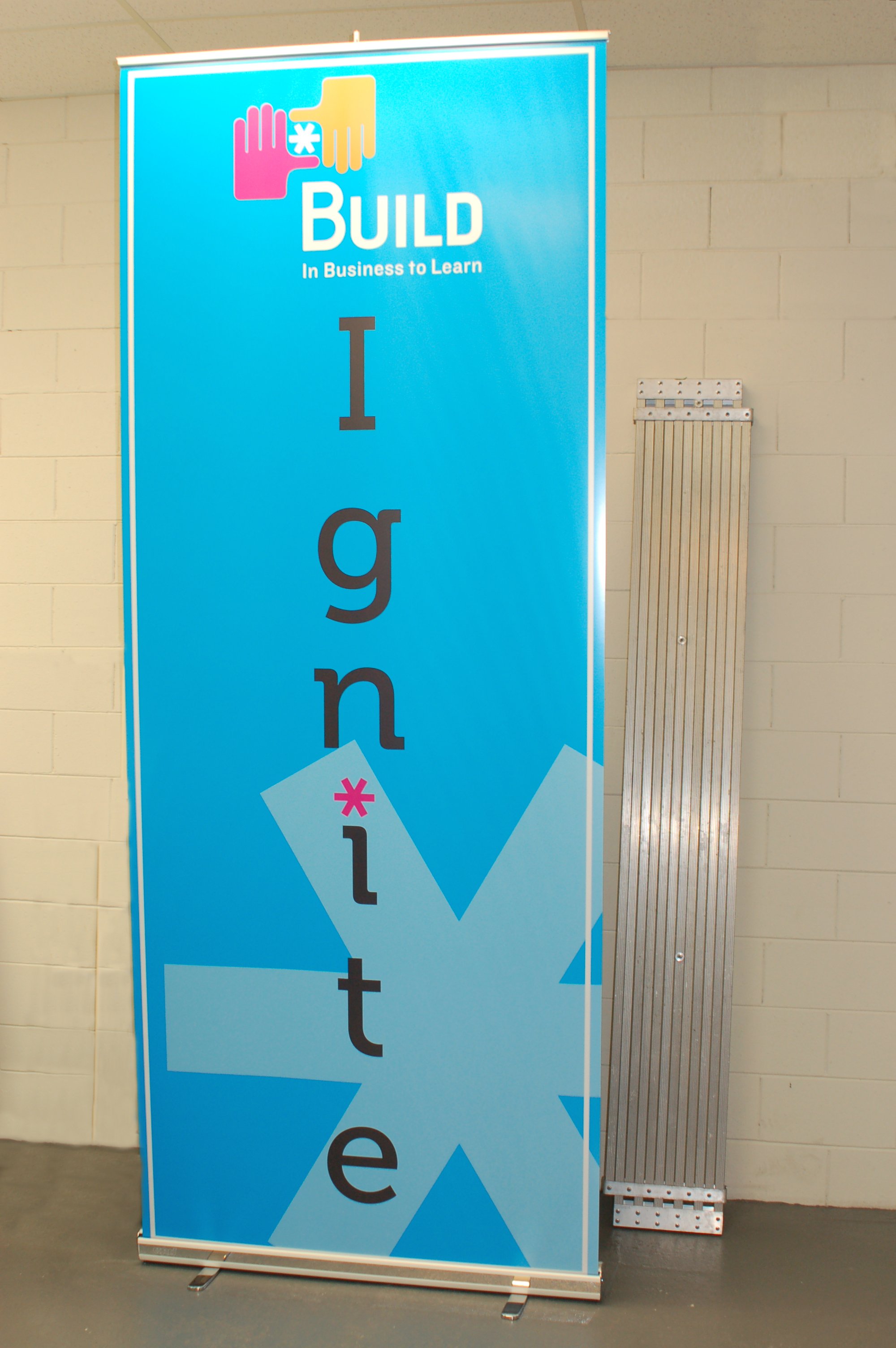 Portable banner stand display used for trade shows, job fairs, and event marketing