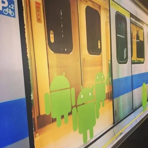 Custom printed wall film with illustrated characters applied to glass for decorative privacy and branding.