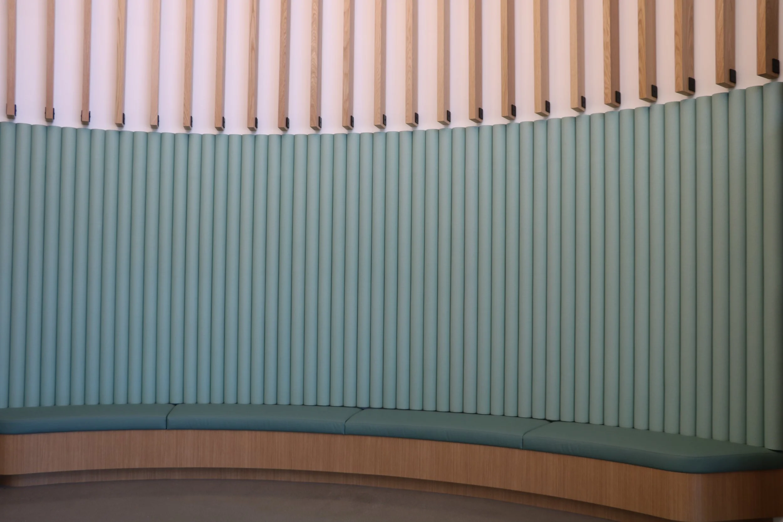 FilzFelt ARO Plank acoustic wall installation with contrasting color accents creating a decorative sound-absorbing feature wall.