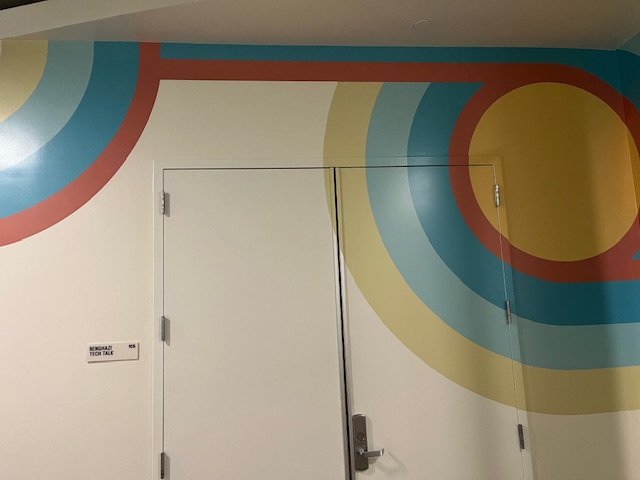 Finished large-scale environmental graphics creating a branded feature wall 