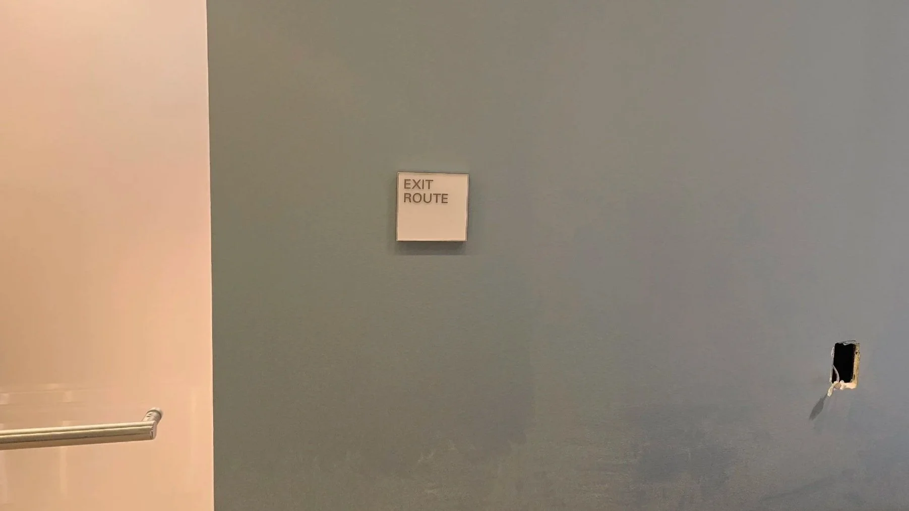 Installed ADA restroom identification sign with tactile lettering and braille on interior wall at eBay Salt Lake City by JP Digital Imaging