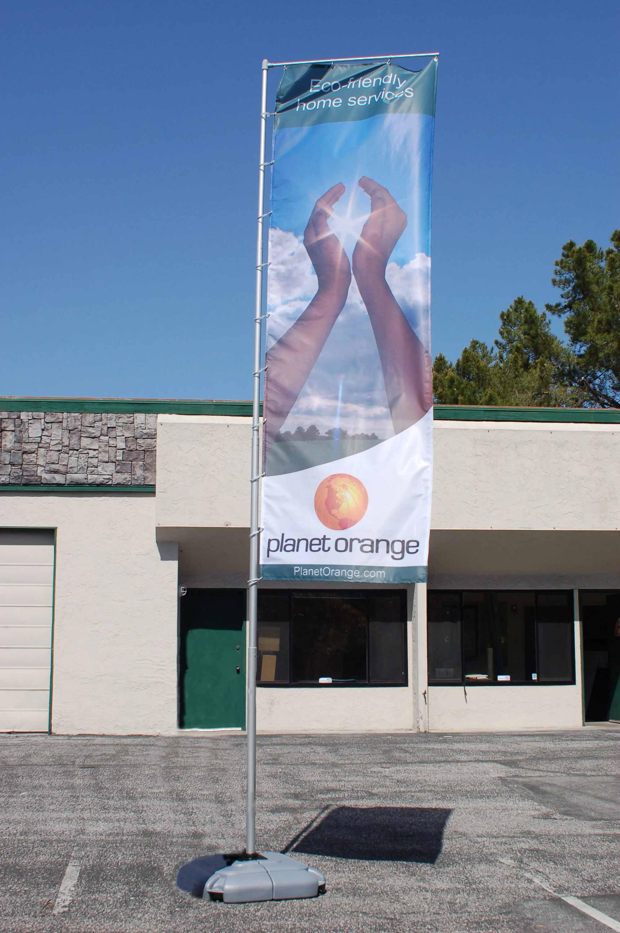 Large-format exterior banner graphic installed to promote brand and marketing campaign