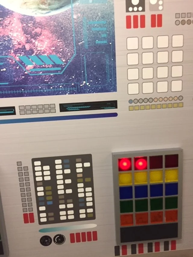 Custom environmental installation combining digital visuals, lighting, and dimensional panels for immersive storytelling.