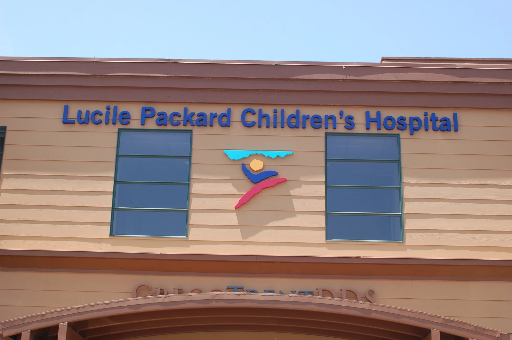 Exterior custom business signage with dimensional letters installed for healthcare facility to enhance visibility and brand identity