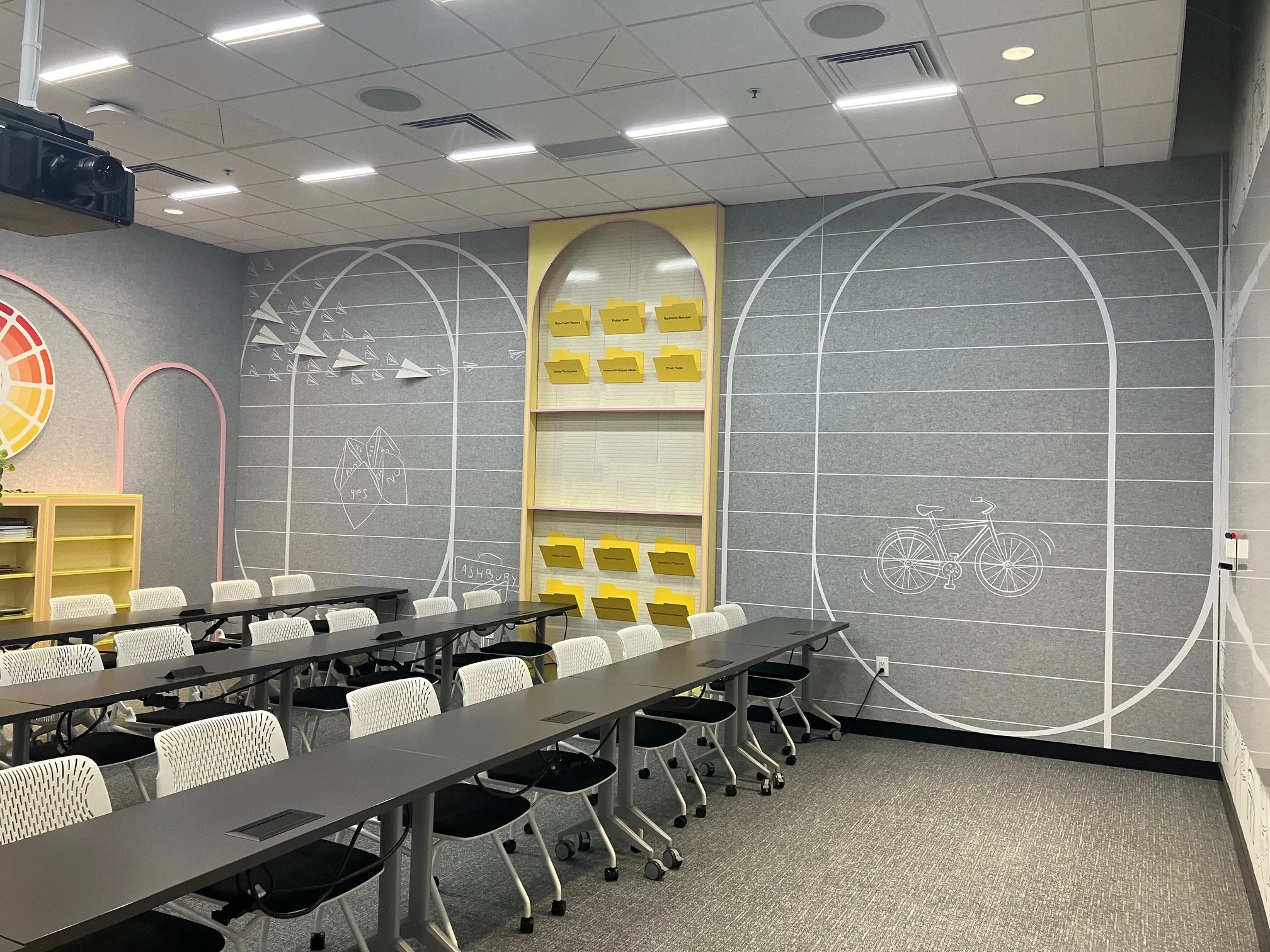 Pinterest San Francisco training room featuring large-scale arched environmental wall graphics, writable collaboration areas, and integrated storage installed by JP Digital.