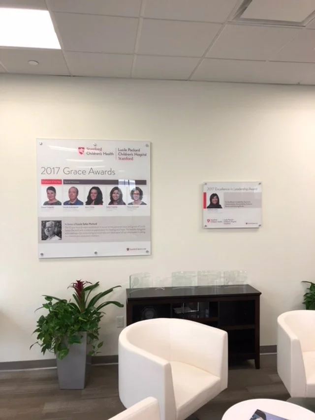 Interior directory and staff identification wall signage installed to support navigation and communication in corporate office environment