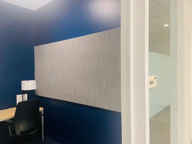 Fabric acoustic wall panel detail providing clean design and sound absorption