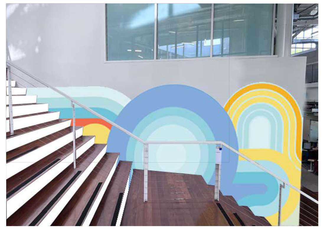 Installed custom geometric wallcovering along commercial staircase featuring layered rainbow-style shapes and coordinated architectural alignment