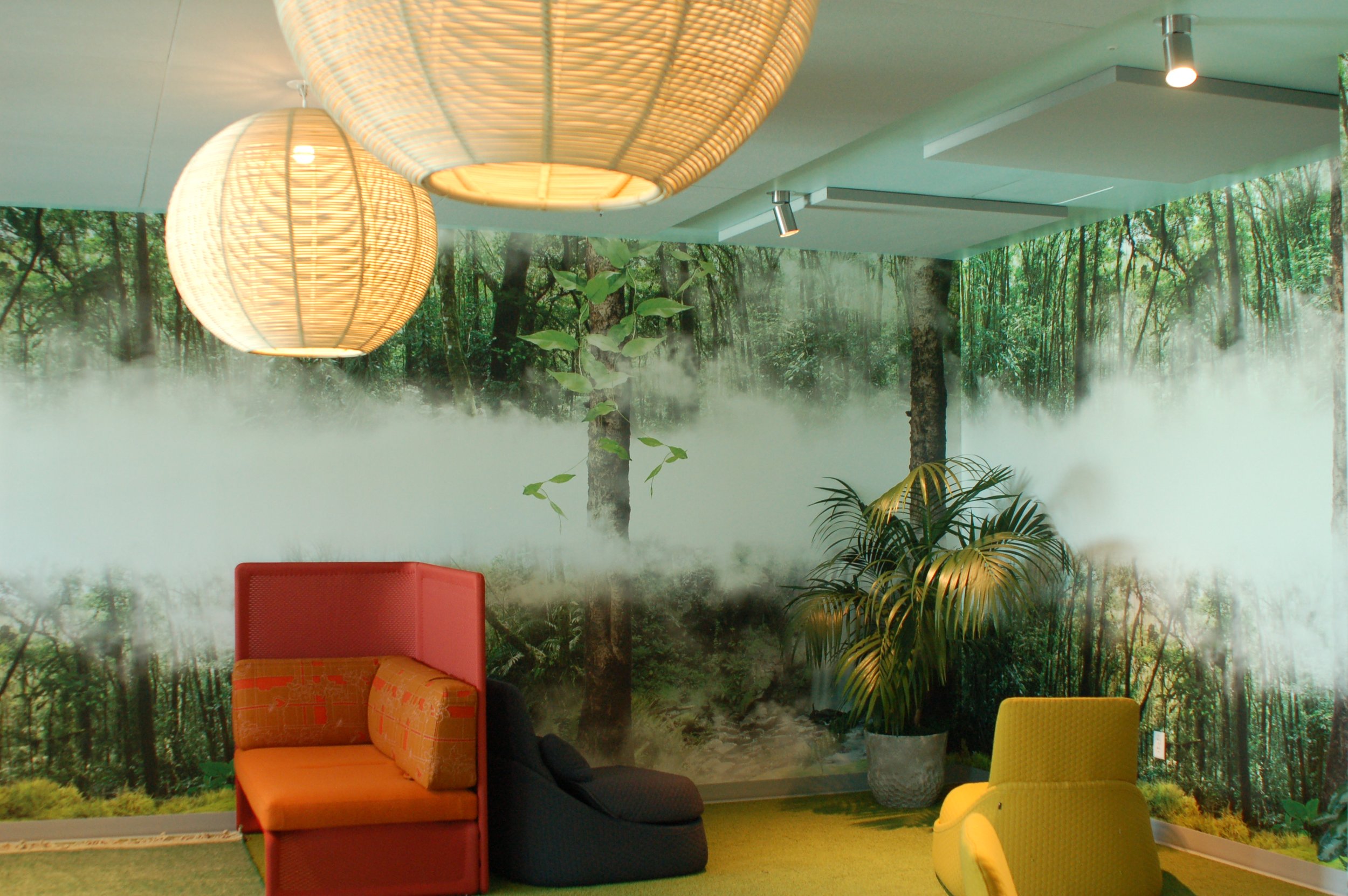 Biophilic-inspired wallcovering with greenery and natural textures enhancing a lounge or collaborative workspace.