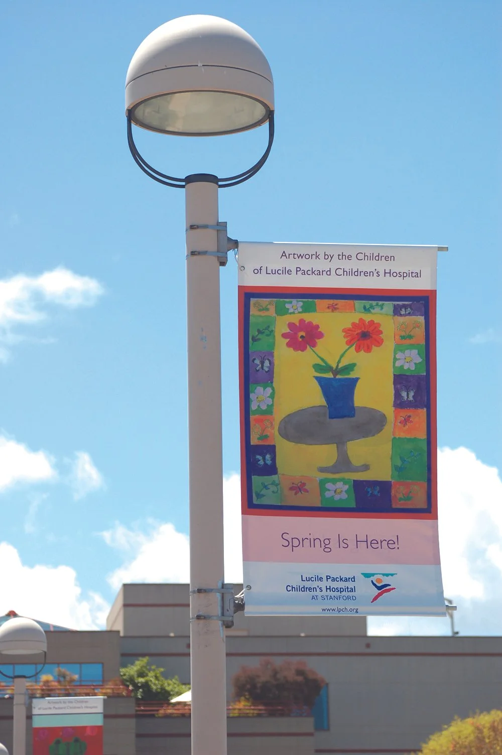 Outdoor community information kiosk providing maps and event details for public wayfinding and communication