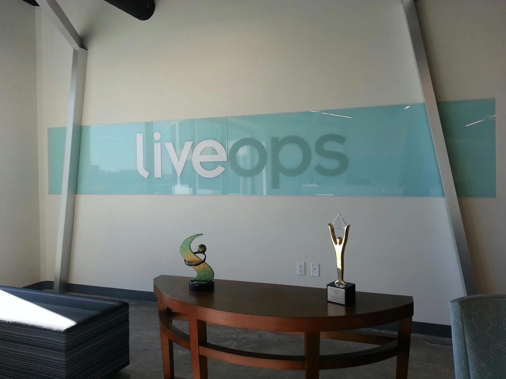 Lobby glass wall with gradient decorative window film and branded reception signage