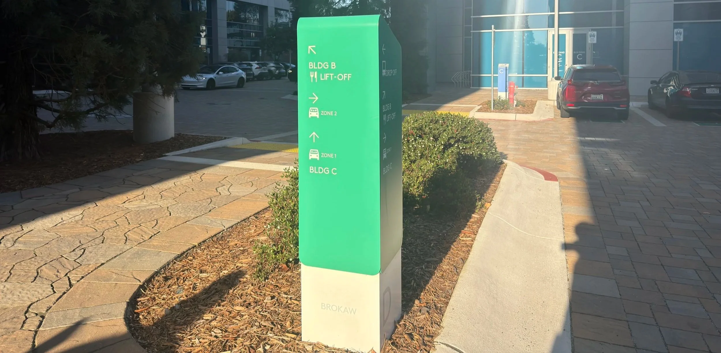 Custom outdoor wayfinding monument sign for commercial office campus navigation and building identification