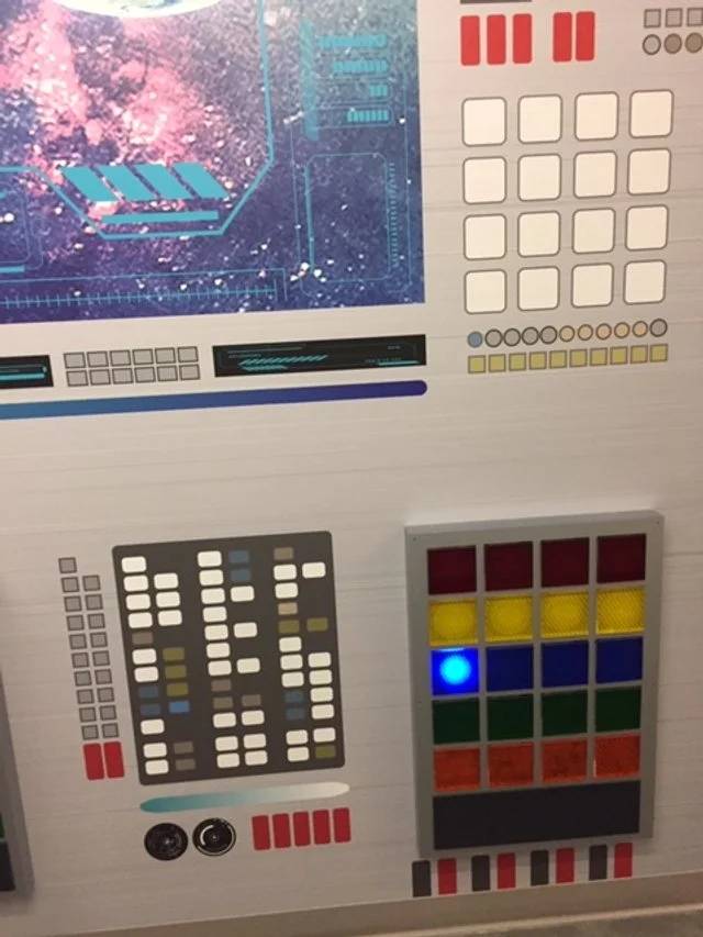 Custom environmental installation combining digital visuals, lighting, and dimensional panels for immersive storytelling.