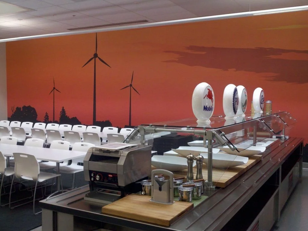 Aviation-themed mural wallcovering installed in a workplace to reinforce brand storytelling and identity.