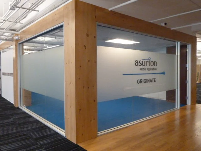 Gradient privacy window film installed on interior glass wall in a commercial office