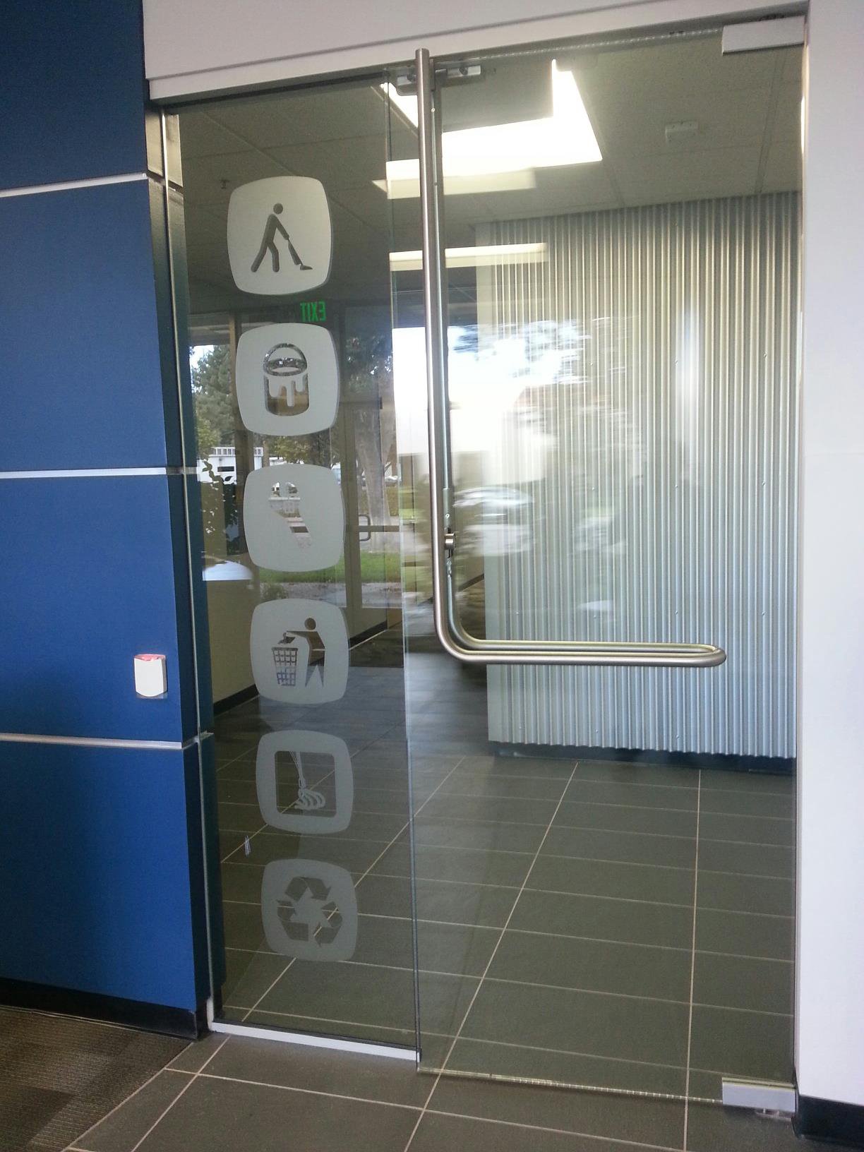 Decorative privacy window film with circular pattern on glass door and office partition