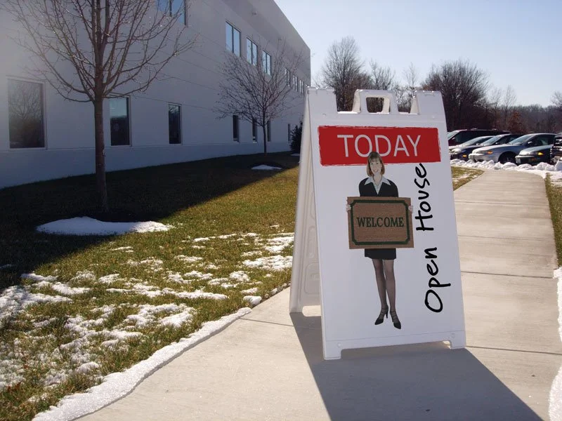 Outdoor promotional A-frame signage used for event wayfinding and temporary business messaging