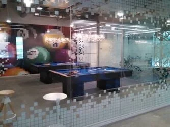 Conference room glass with patterned privacy window film in modern workplace