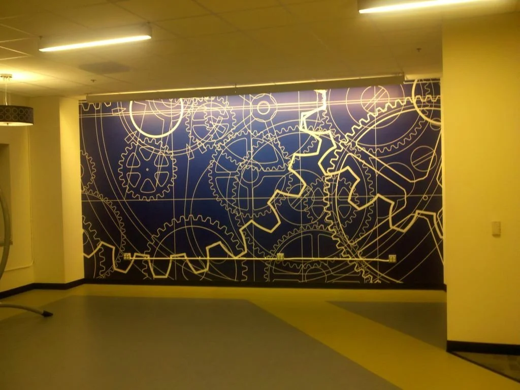Illuminated custom map wall mural creating an interactive and visually impactful environmental graphic.