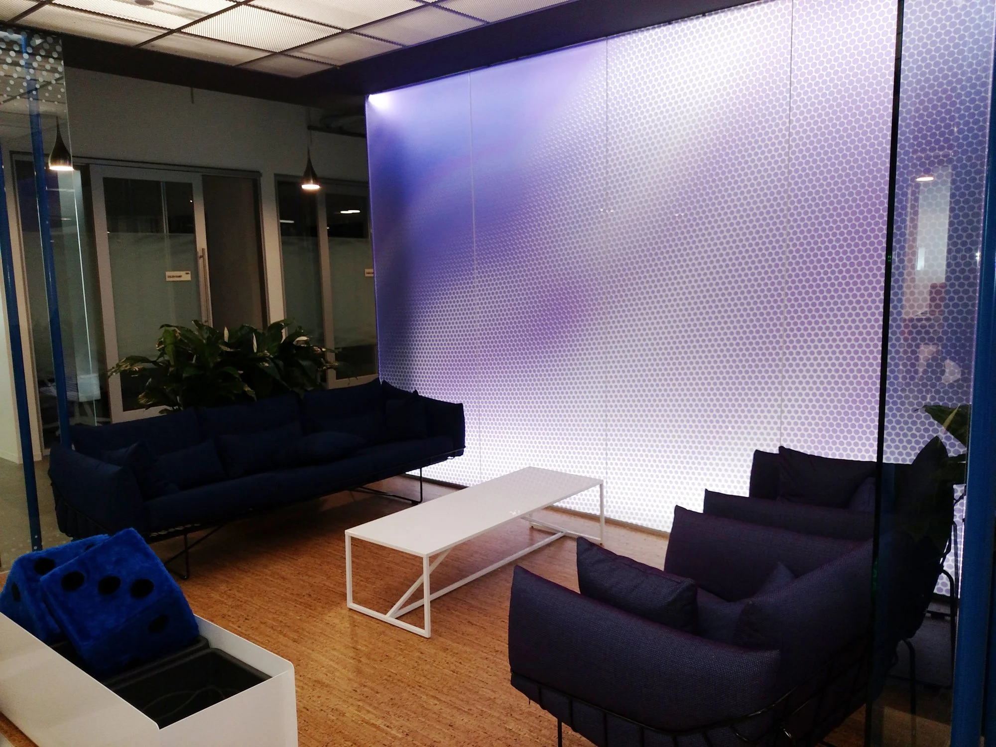 Large-scale gradient privacy window film used on glass walls to enhance interior design while maintaining daylight.