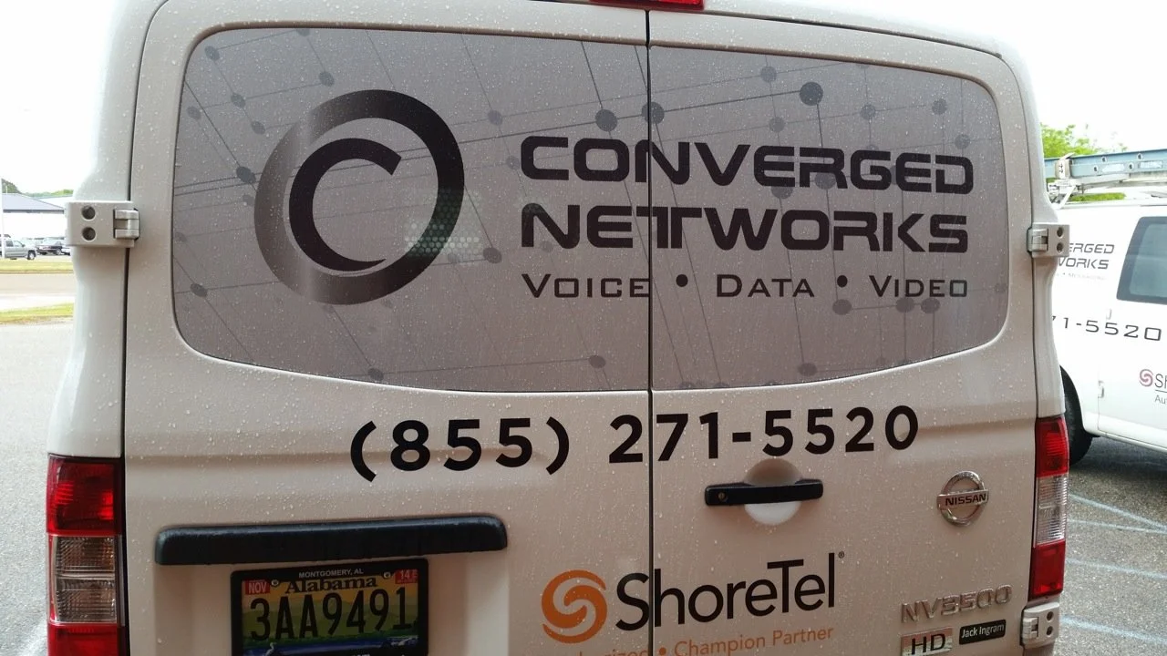 Business vehicle graphics with logo, phone number, and professional fleet branding