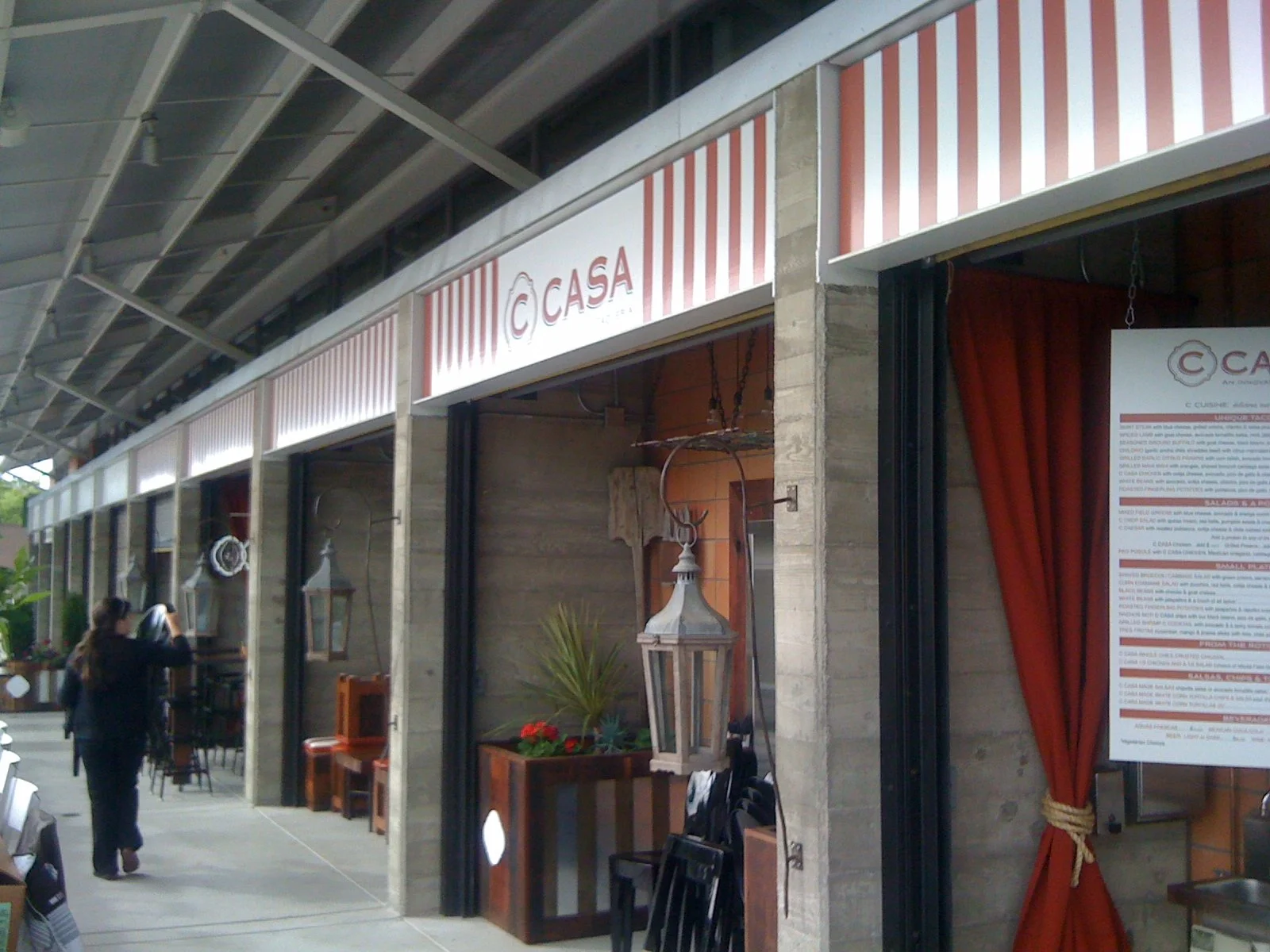 Custom storefront awning signage for CASA reinforcing brand identity and exterior presence