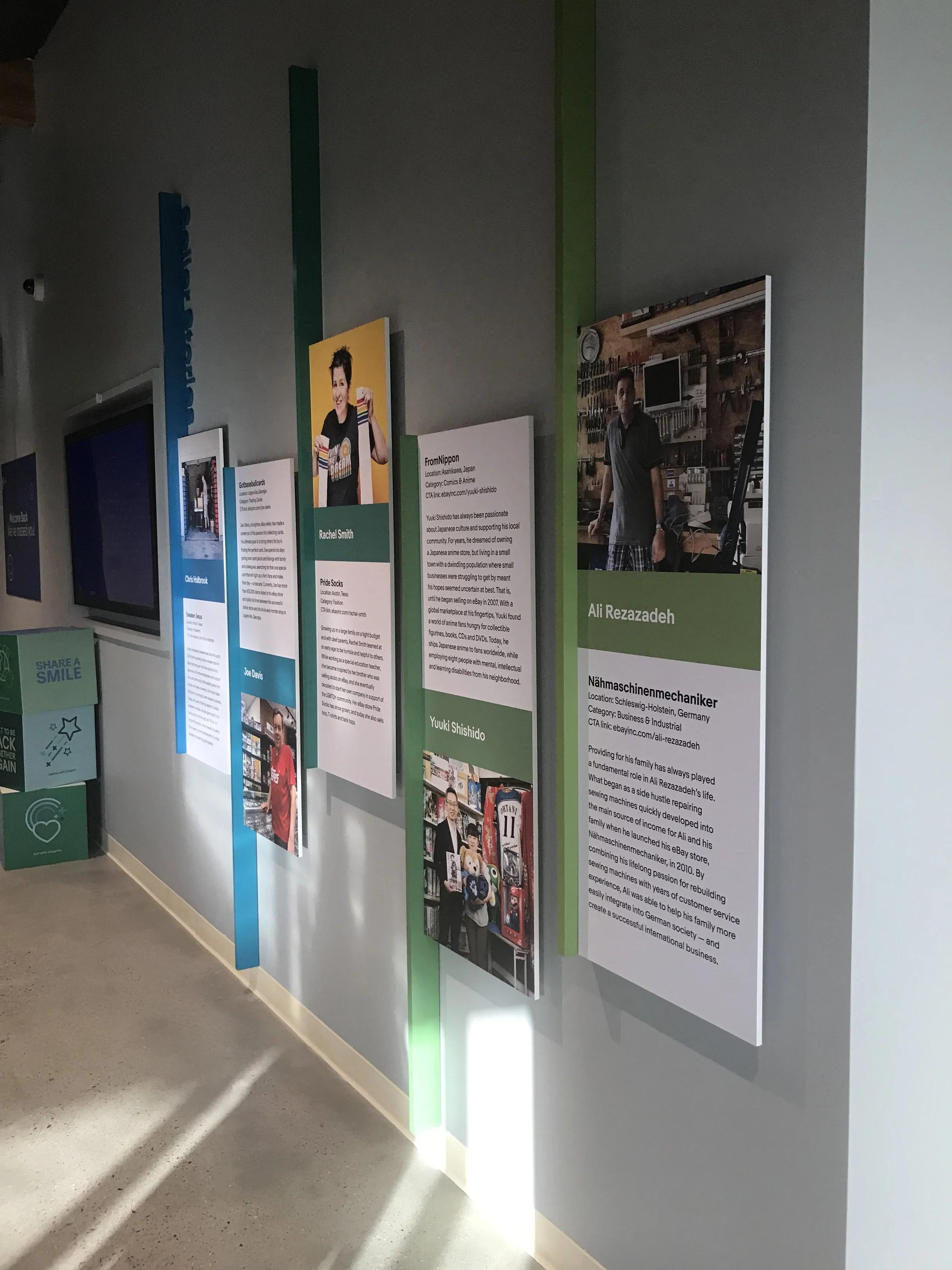 Custom environmental graphic system transforming hallway space into an interactive brand storytelling environment.