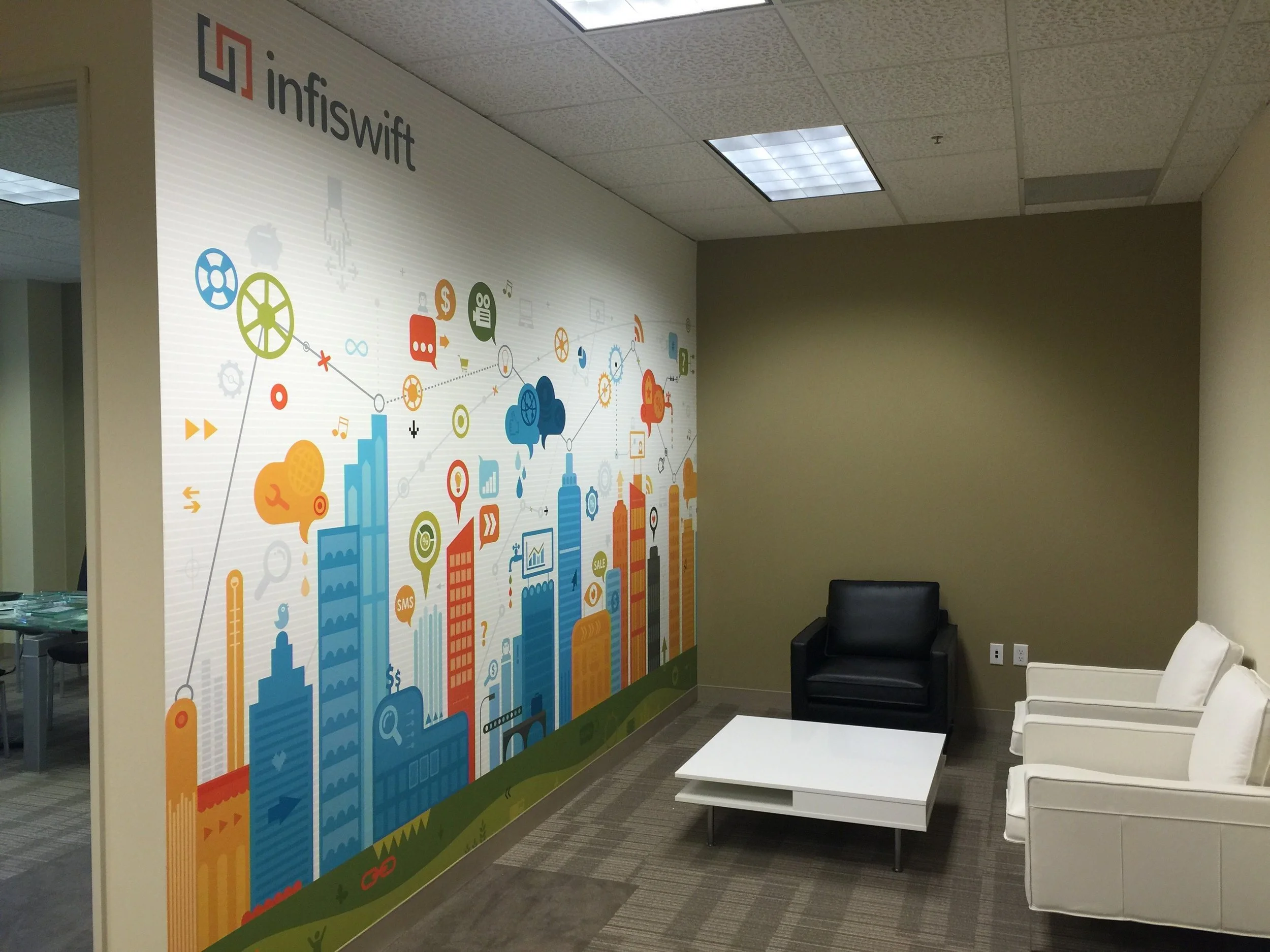 Playful illustrated city-themed wallcovering designed to energize a creative workspace or training area.