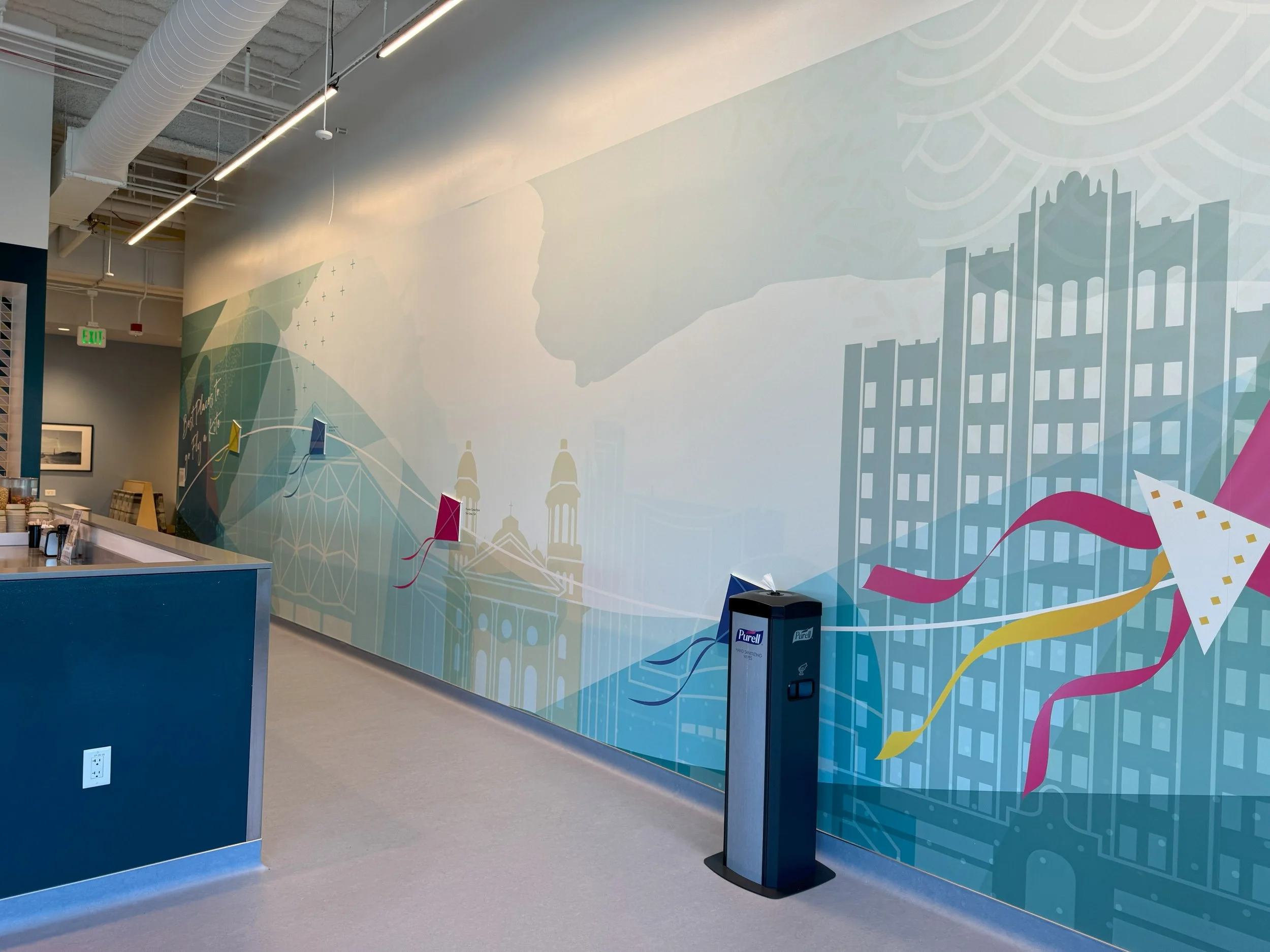 Integrated wall graphics and directory signage providing clear navigation within a corporate interior.